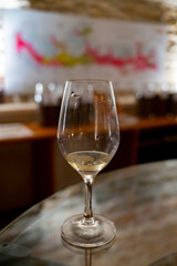 Obraz premium Wine tasting in underground cellars caves of French wine domain in Puligny-Motrachet village, Burgundy, France