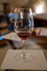 Wine tasting in underground cellars caves of French wine domain in Puligny-Motrachet village, Burgundy, France