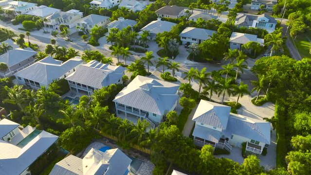 Aerial view of big expensive homes in Florida closed living golf clubs. Vacation houses as example of real estate development in american suburbs