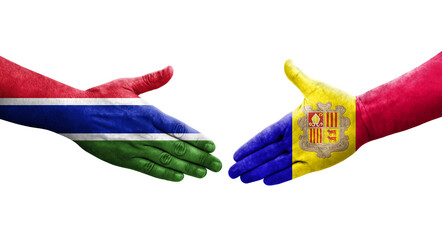 Handshake between Andorra and Gambia flags painted on hands, isolated transparent image.