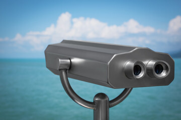 Metal tower viewer installed near sea. Mounted binoculars