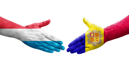 Handshake between Andorra and Luxembourg flags painted on hands, isolated transparent image.