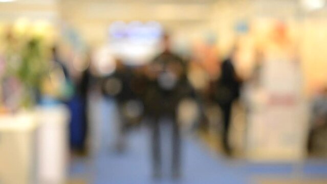 Blurred Background people at mall exhibition walking associate walk around