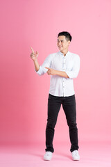 Fototapeta na wymiar Asian man full body image, isolated on pink background