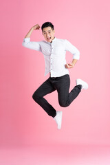 Asian man full body image, isolated on pink background
