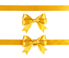 Gold ribbons with bow isolated on white background