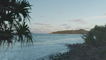 sunset shot of cape byron from the town of byron bay