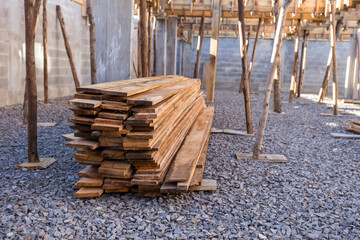 building under construction in sunny day. construction materials