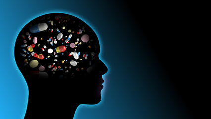 Pills and capsules in human brain head silhouette with copy space.
