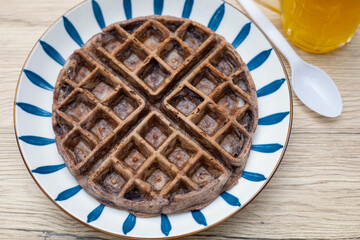 Dessert waffles placed on a wooden table surface