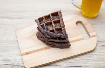 Dessert waffles placed on a wooden table surface