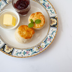 Butter scone set with raspberry and clotted cream