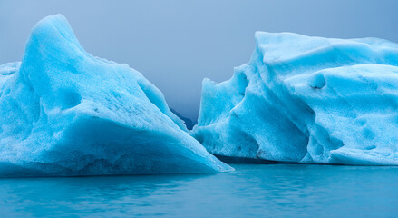 blue iceberg in polar regions in the sea