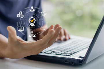 Businessman hand showing with signs of the top service Quality control certification checked guarantees of the standard of company product. Concept on virtual screen.