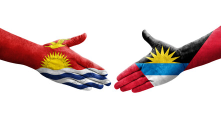 Handshake between Antigua and Barbuda and Kiribati flags painted on hands, isolated transparent image.