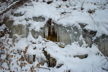 Selective focus. Frozen waterfall. Winter background. Ice.