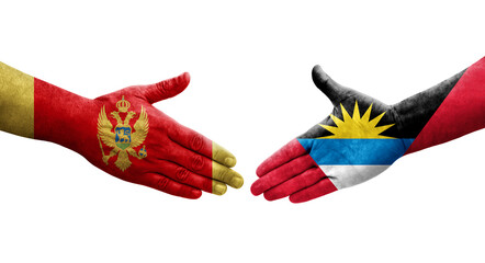 Handshake between Antigua and Barbuda and Montenegro flags painted on hands, isolated transparent image.
