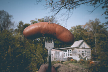 Selective focus. Sausage on a fork. Farm. © Юлия Тарабанова