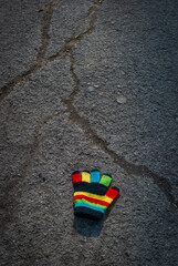 Selective focus. Multicolored children's glove. Childhood.