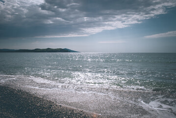 Blurred background. Rest on the sea. Cloud over the sea.