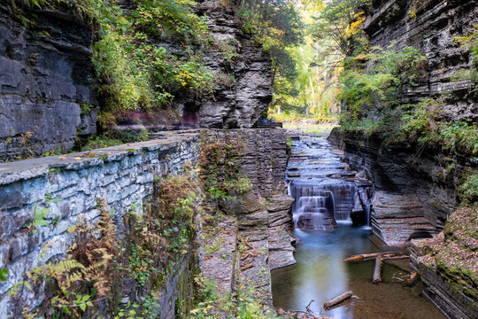 Late afternoon autumn - fall photo of Robert H. Treman State Park near Ithaca NY, Tompkins County New York.   Image photographed with a tilt shift lens and ND filter.

