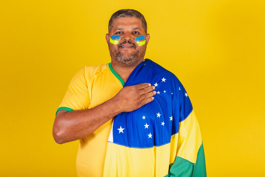 Brazilian Black Man, Soccer Fan From Brazil. With His Hand On His Chest, Singing The National Anthem. Democracy.