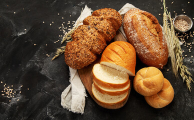 Bread assortment on dark background.