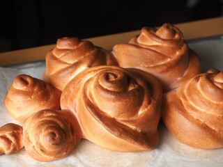 golden brown baked rose shaped bread bun