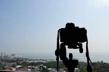 black digital camera shooting city landscape