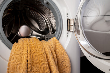 laundry in an open washing machine in the bathroom