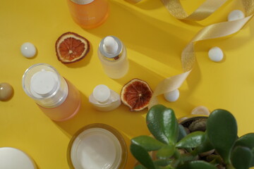 Immunity protection concept, antiviral prevention Serum and cosmetics with vitamin C. Essential oil from citrus fruits. Hyaluronic acid, botulin, serum in vials. Concept of cosmetic surgery for facial