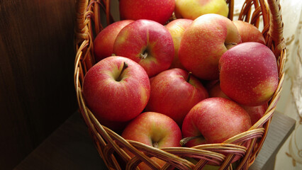 Red apples in a wicker basket.Still life. Close-up. Selective focus with copy space.