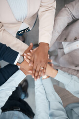 Hands, collaboration and solidarity with a team of business people standing in a huddle or circle...
