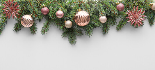 Fir tree branches and Christmas balls on white background