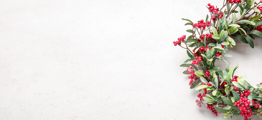 Beautiful Christmas wreath on white background with space for text