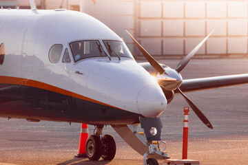 Turboprop private jet closeup in sunset