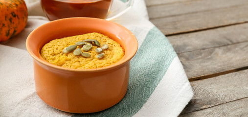 Tasty pumpkin pudding on wooden table. Thanksgiving Day celebration