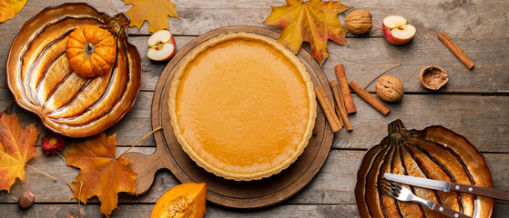 Composition with tasty pumpkin pie on wooden background. Thanksgiving Day celebration © Pixel-Shot