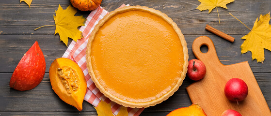Composition with tasty pumpkin pie on wooden background. Thanksgiving Day celebration