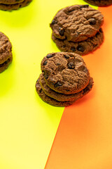 Fototapeta na wymiar Chocolate chip cookies on Stacked, chocolate chip cookies close up., with color background