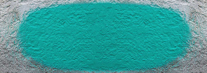 Green blot of paint on a gray background. Green paint on grey. background image. Template for text. Color image. Wall surface. Finishing work. Geometric shape oval.