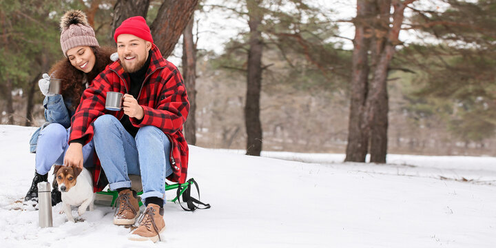 Happy Interracial Couple With Dog In Forest On Winter Day