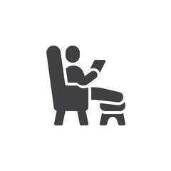 Man in armchair using laptop vector icon