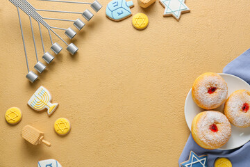 Composition with menorah, wooden dreidels, cookies and donuts for Hanukkah celebration on color background