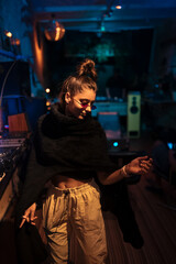 Obraz premium Beautiful female dancing in a small club