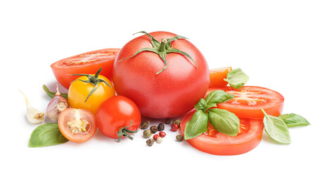 Heap of fresh tomatoes and spices on white background