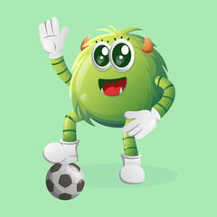 Cute green monster play football, soccer ball