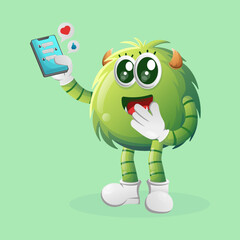 Cute green monster holding mobile phone with text messages