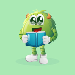 Cute green monster reading a book