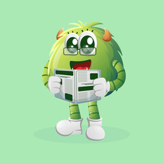 Cute green monster read newspapers